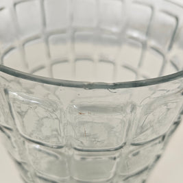 Close-up of a textured glass vase on a light background