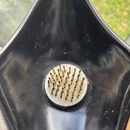 Top down view of ikebana vase with a kenzan in the middle