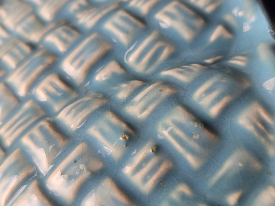 Close up of scratches on ceramic vase