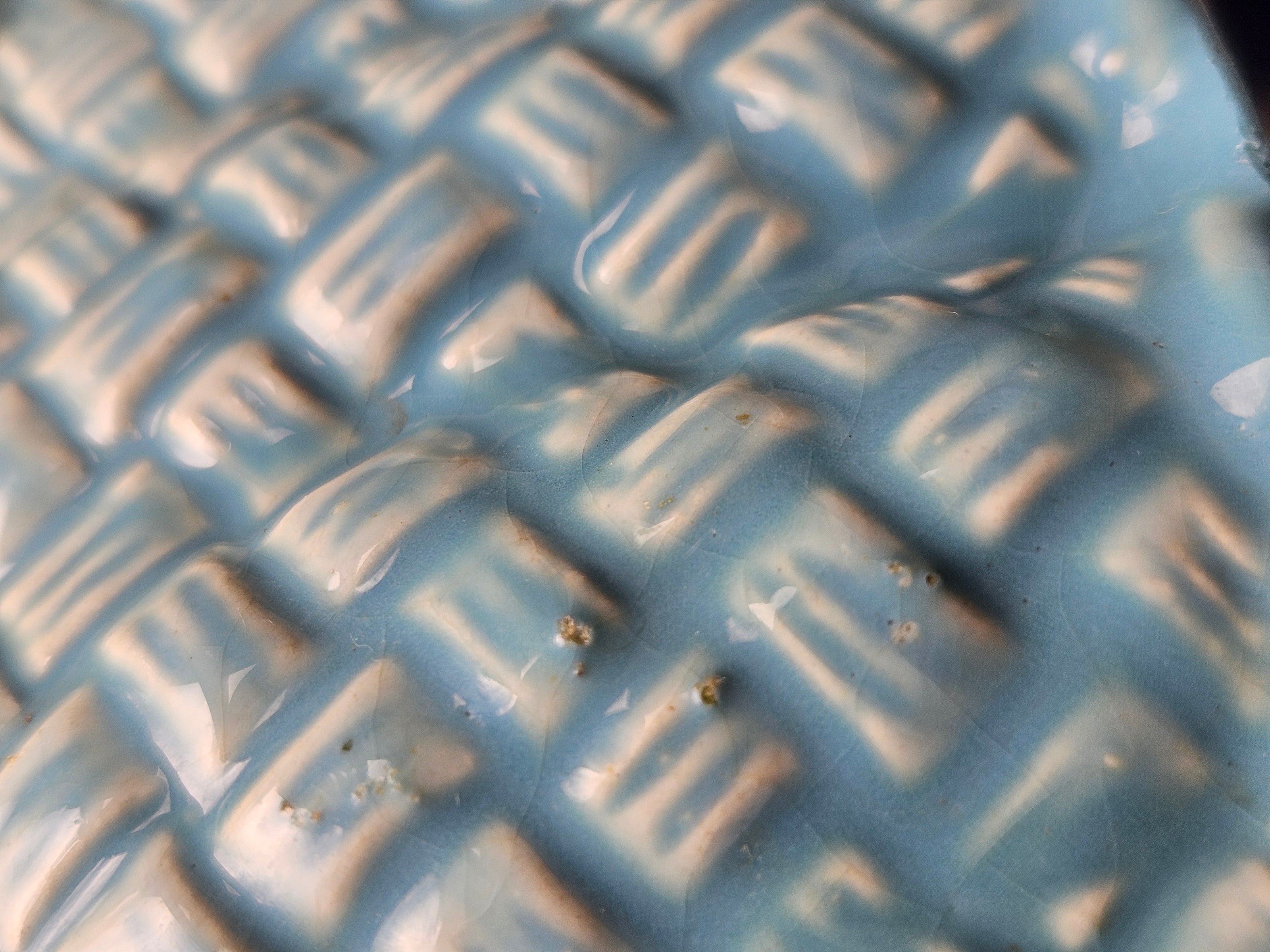 Close up of scratches on ceramic vase