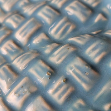 Close up of scratches on ceramic vase