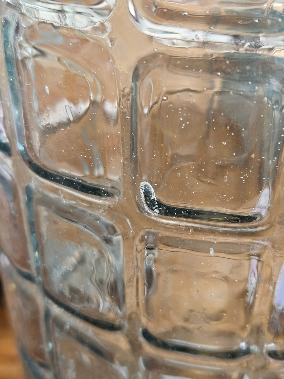 Close-up of a textured glass surface with air bubbles