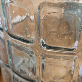 Close-up of a textured glass surface with air bubbles