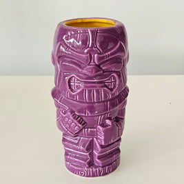 Purple tiki style Thanos vase on a white background