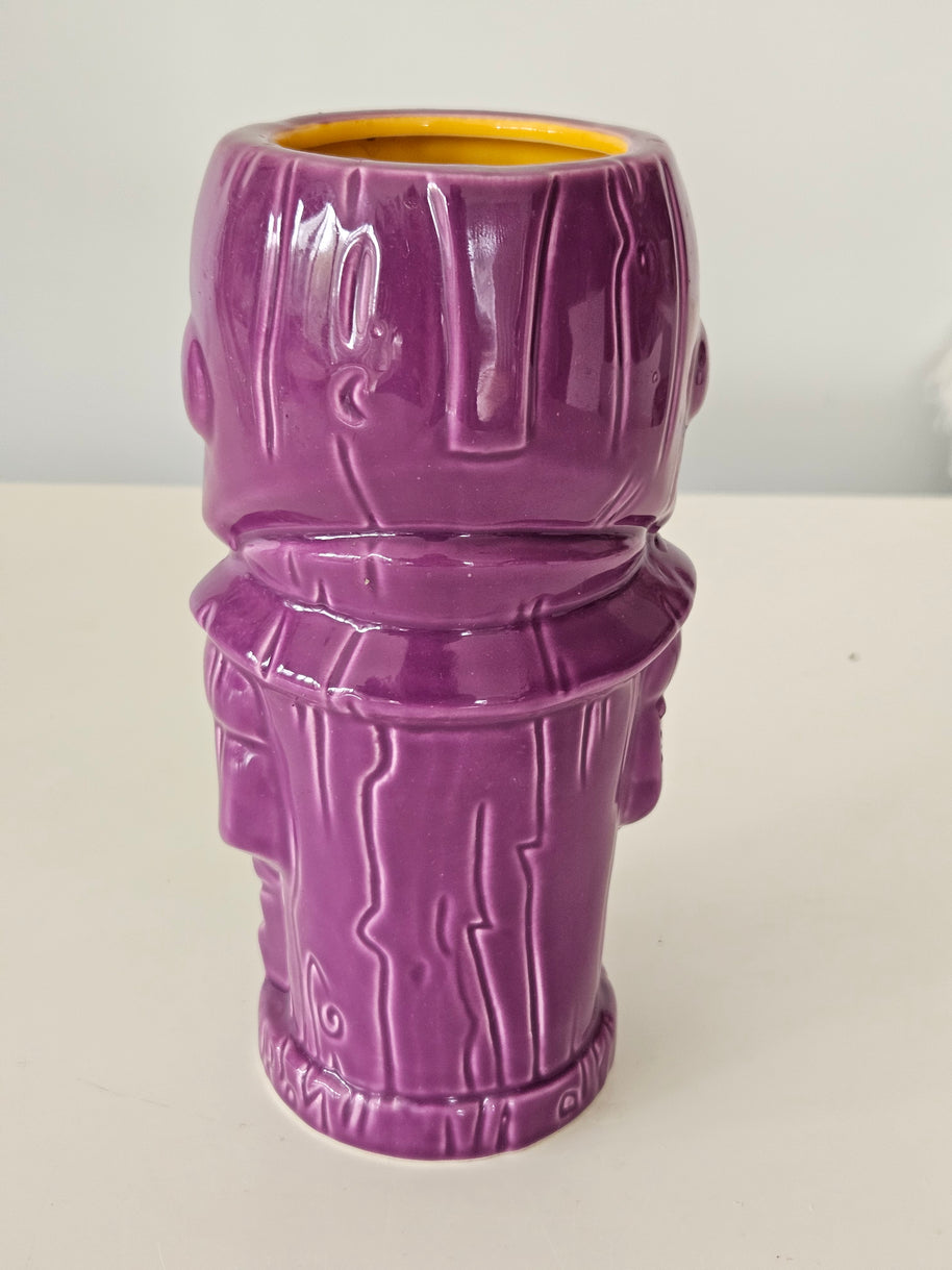 Back view of a purple Thanos vase on a white background