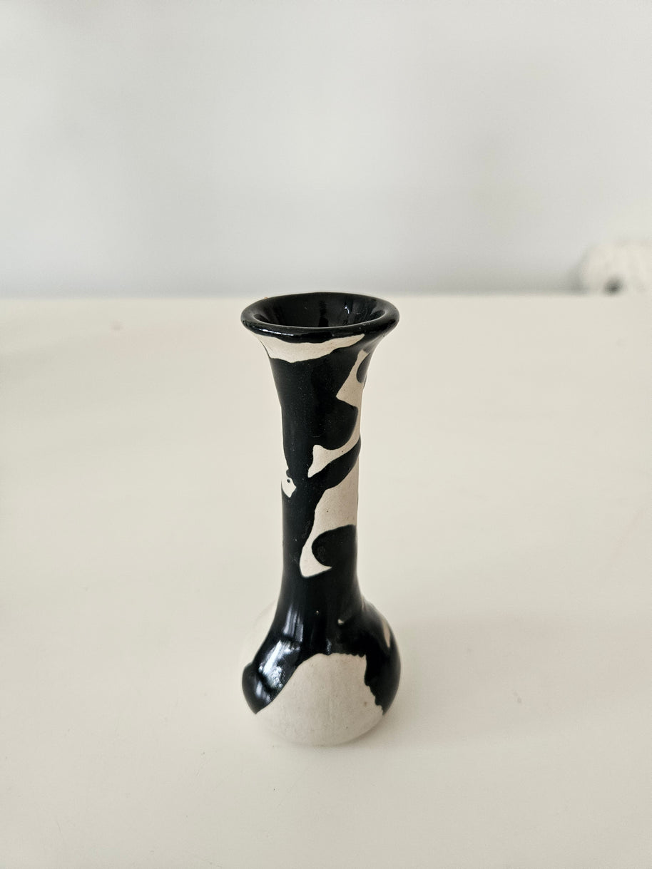 Black and white ceramic bud vase on a white background