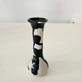 Black and white patterned bud vase on a white background