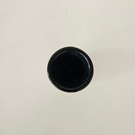 Top down view of a black vase on a white background