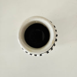Top down view of a black and white ceramic vase