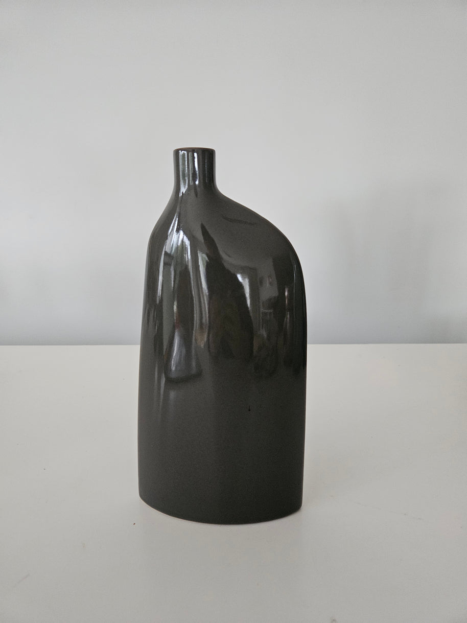 Black ceramic vase on a white background