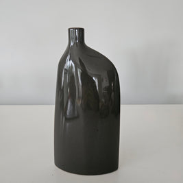Black ceramic vase on a white background