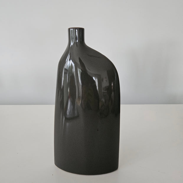 Black ceramic vase on a white background