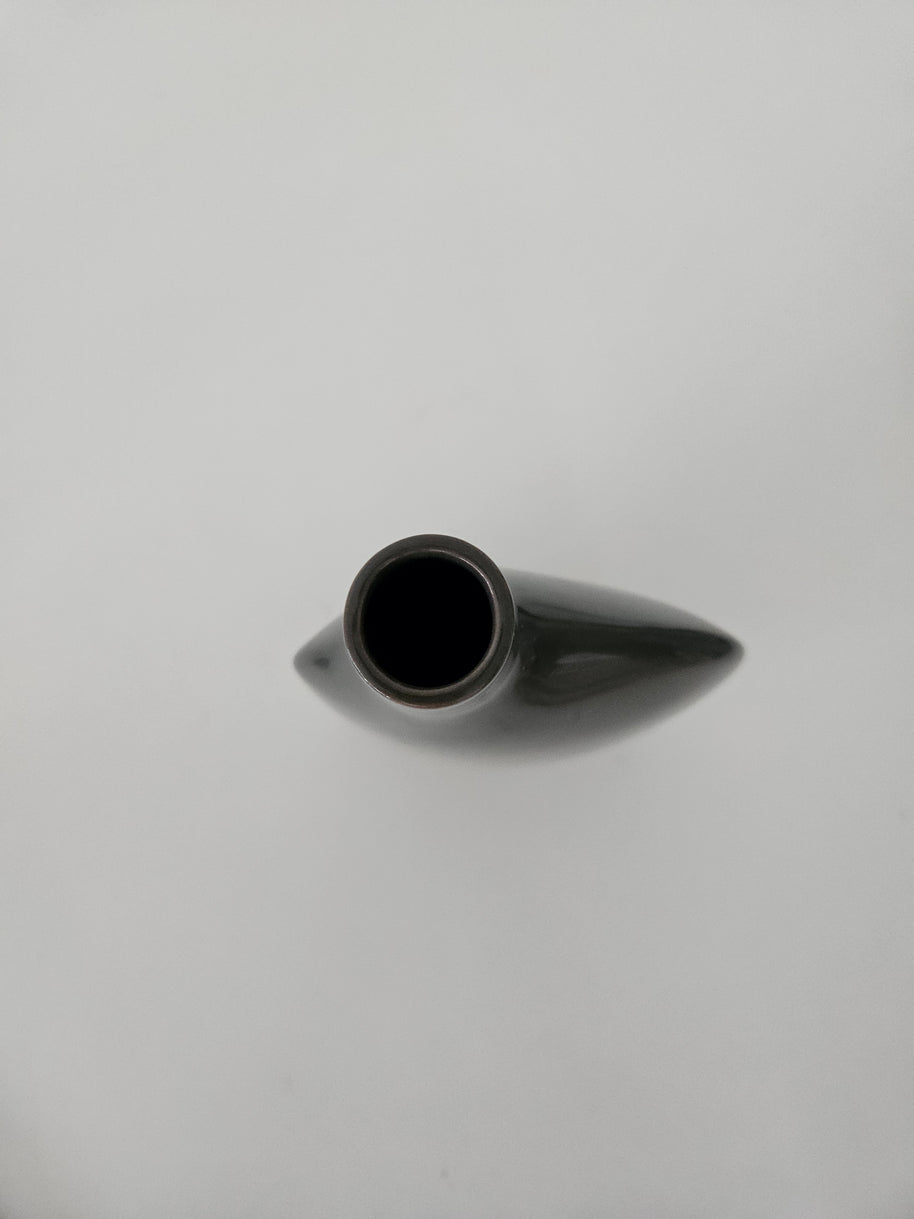 Top down view of a black ceramic vase