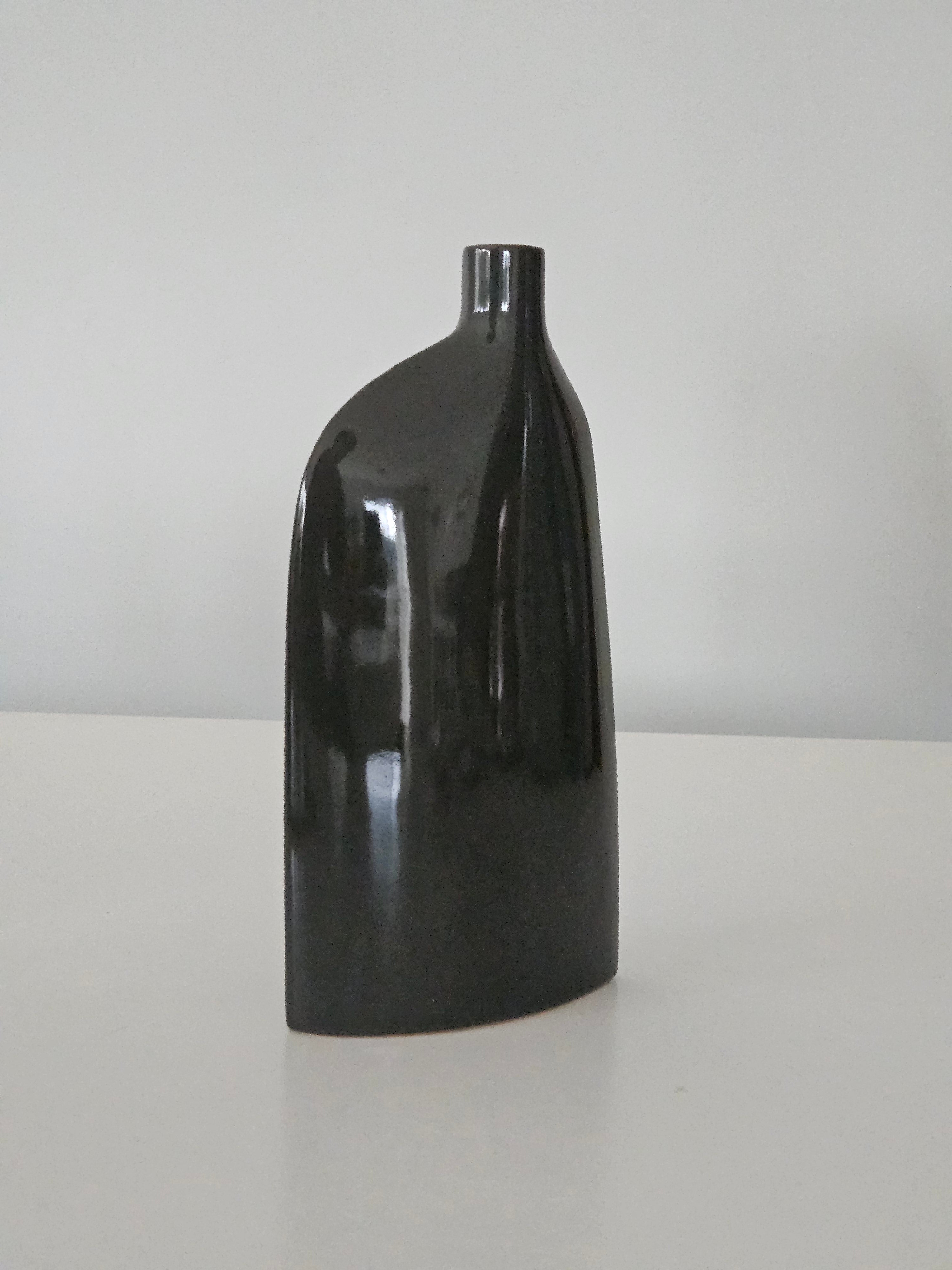 Side view of a black ceramic vase
