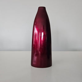 Glossy red-brown cylindrical vase on a white background