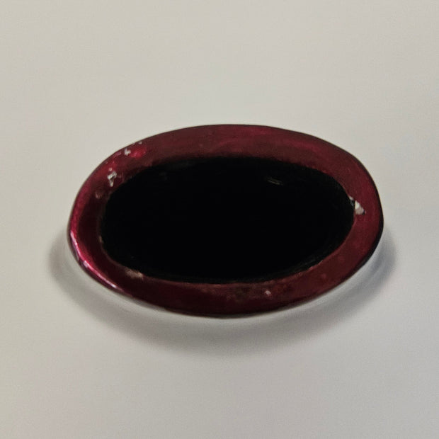 Top down view of a red-brown ceramic vase on a white background
