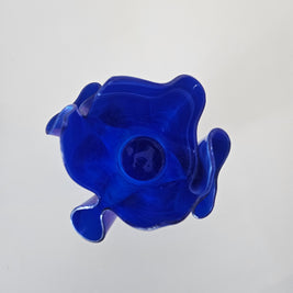 Top down view of a blue glass handkerchief vase