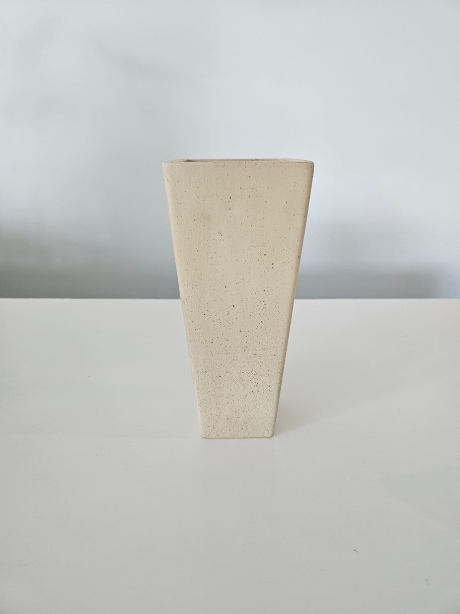 Rectangular beige stone vase on a white background