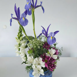 Flower arrangement in blue vase