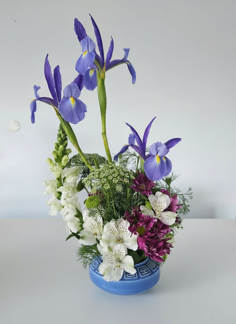 Flower arrangement in blue vase