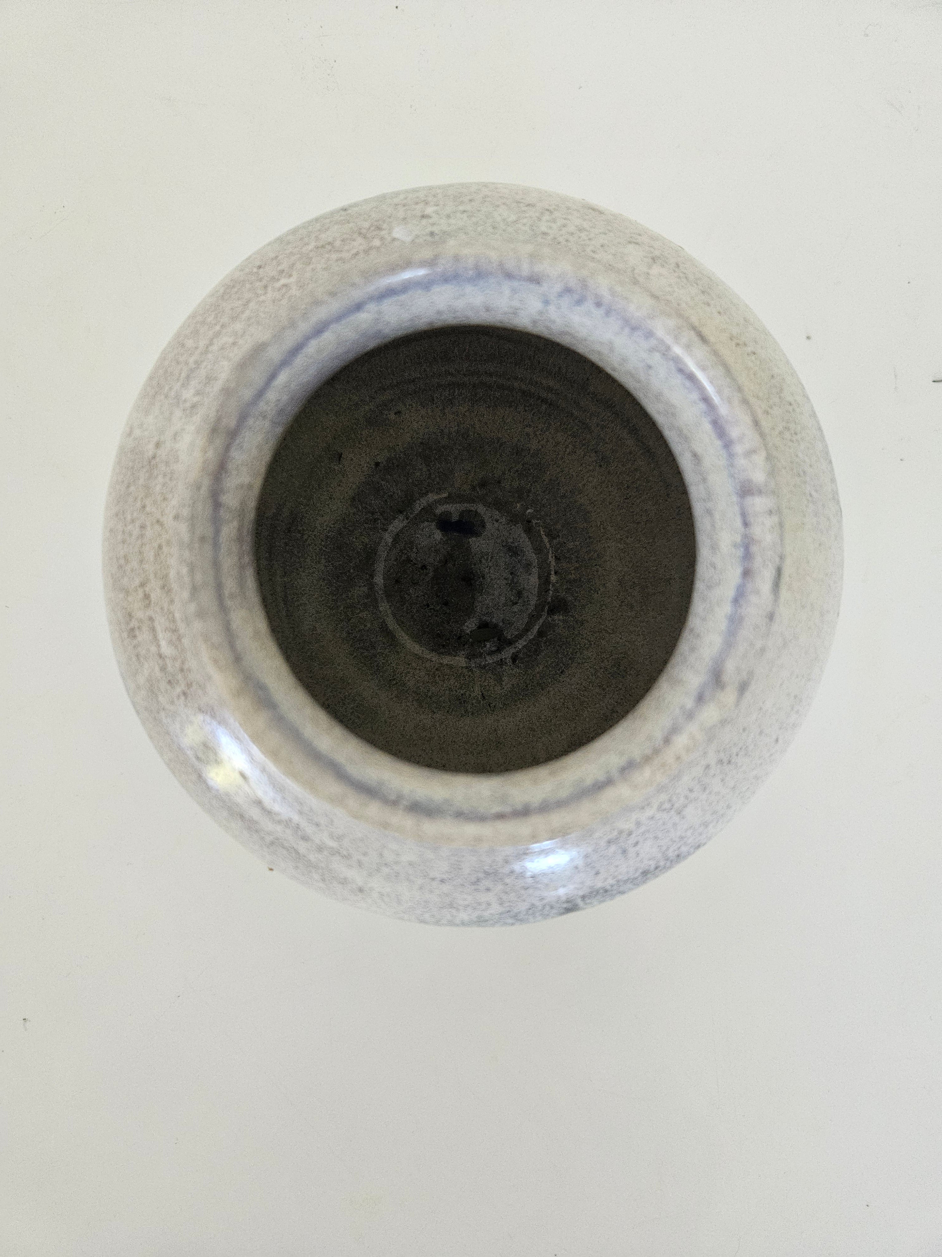 Blue and grey ceramic fishbowl vase arrangement