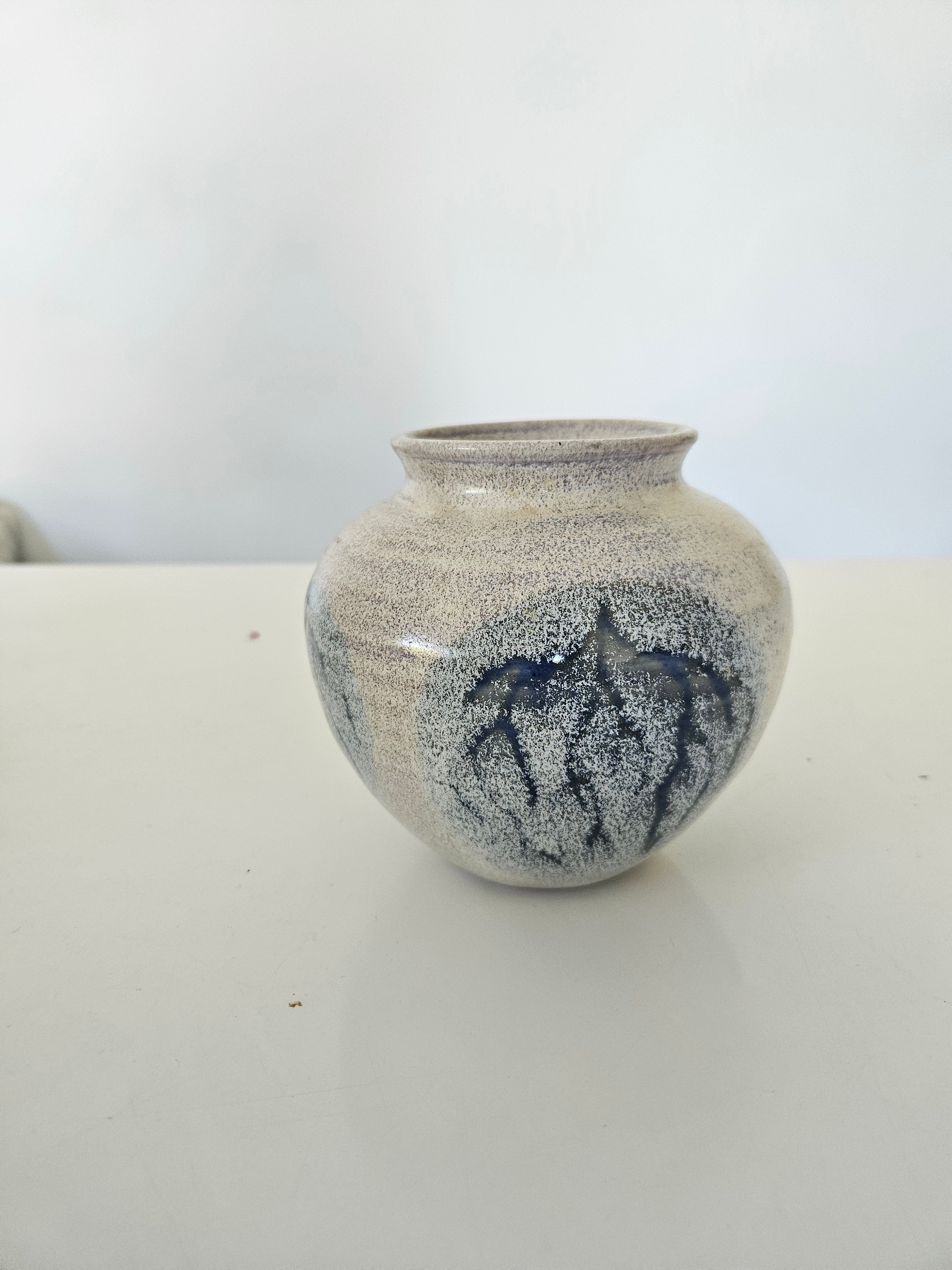 Blue and grey ceramic fishbowl vase arrangement