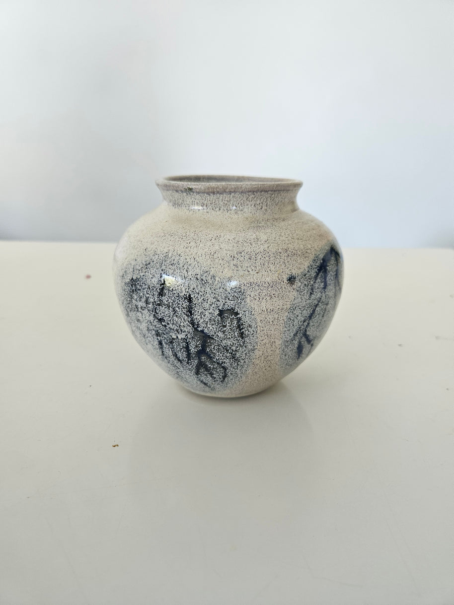 Blue and grey ceramic fishbowl vase arrangement