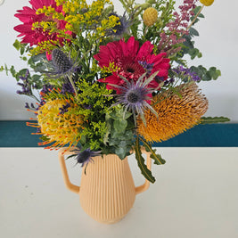 Light orange handled vase arrangement