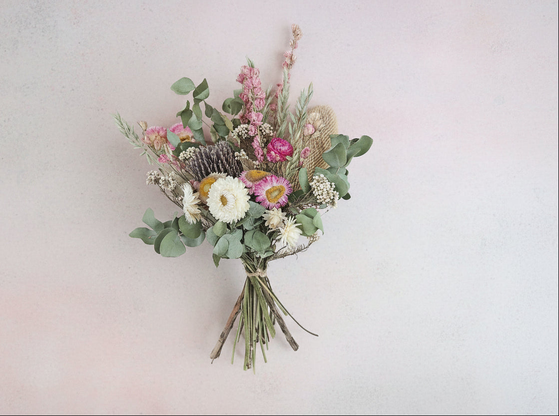 Bouquet of dried flowers on a textured surface