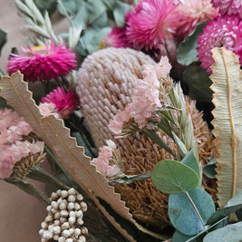 Banksia, statice, strawflowers and eucalyptus in a bouquet