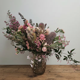 Fresh flower arrangement on a timber table