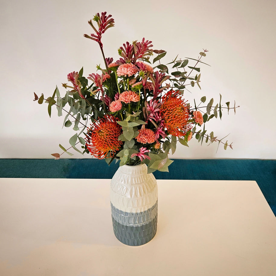 Blue striped ceramic vase arrangement