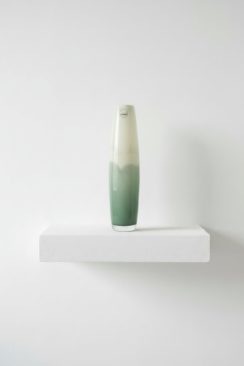Tall ceramic vase with gradient design on a white background