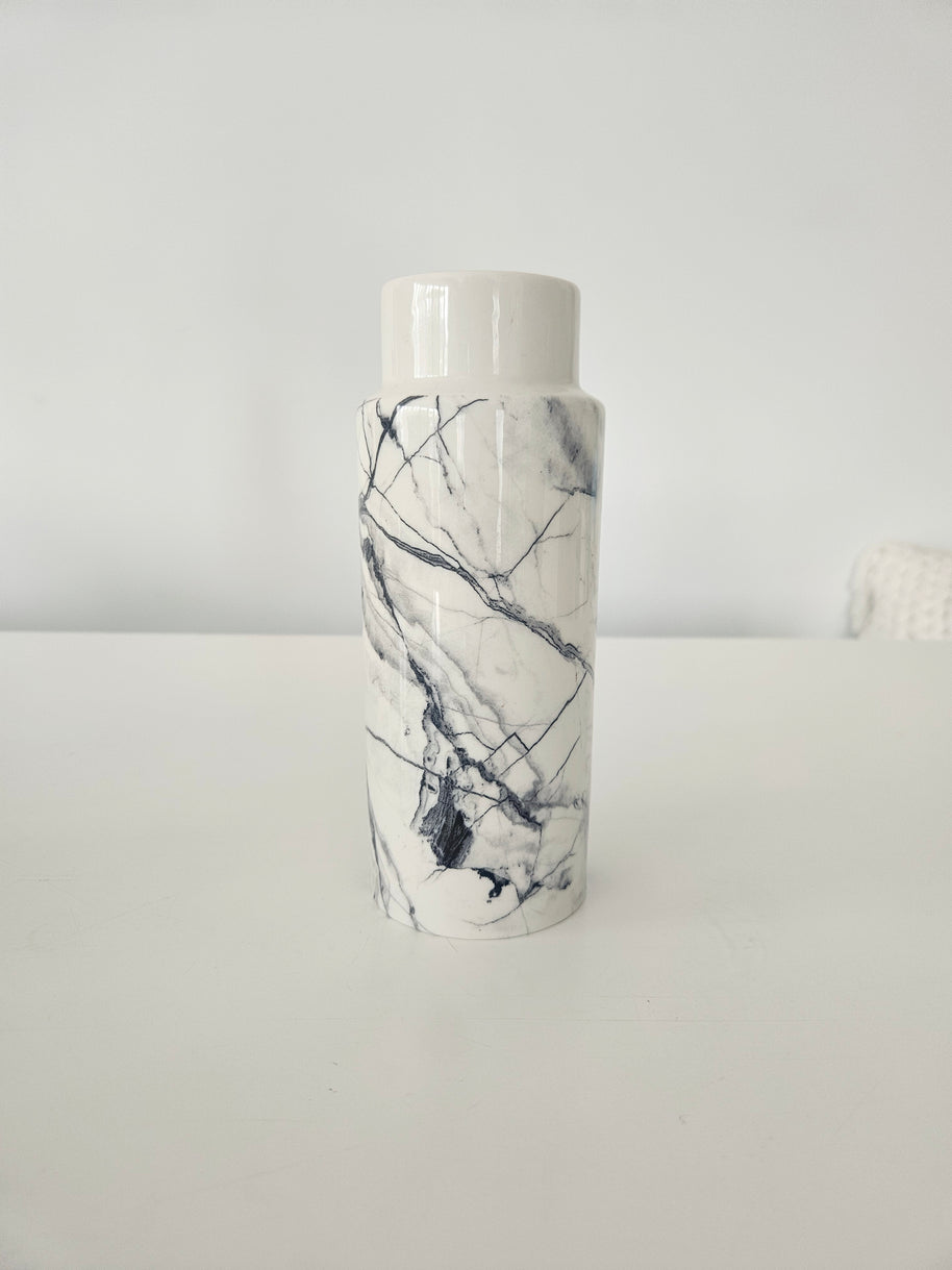 Vase with a marble pattern on a white background