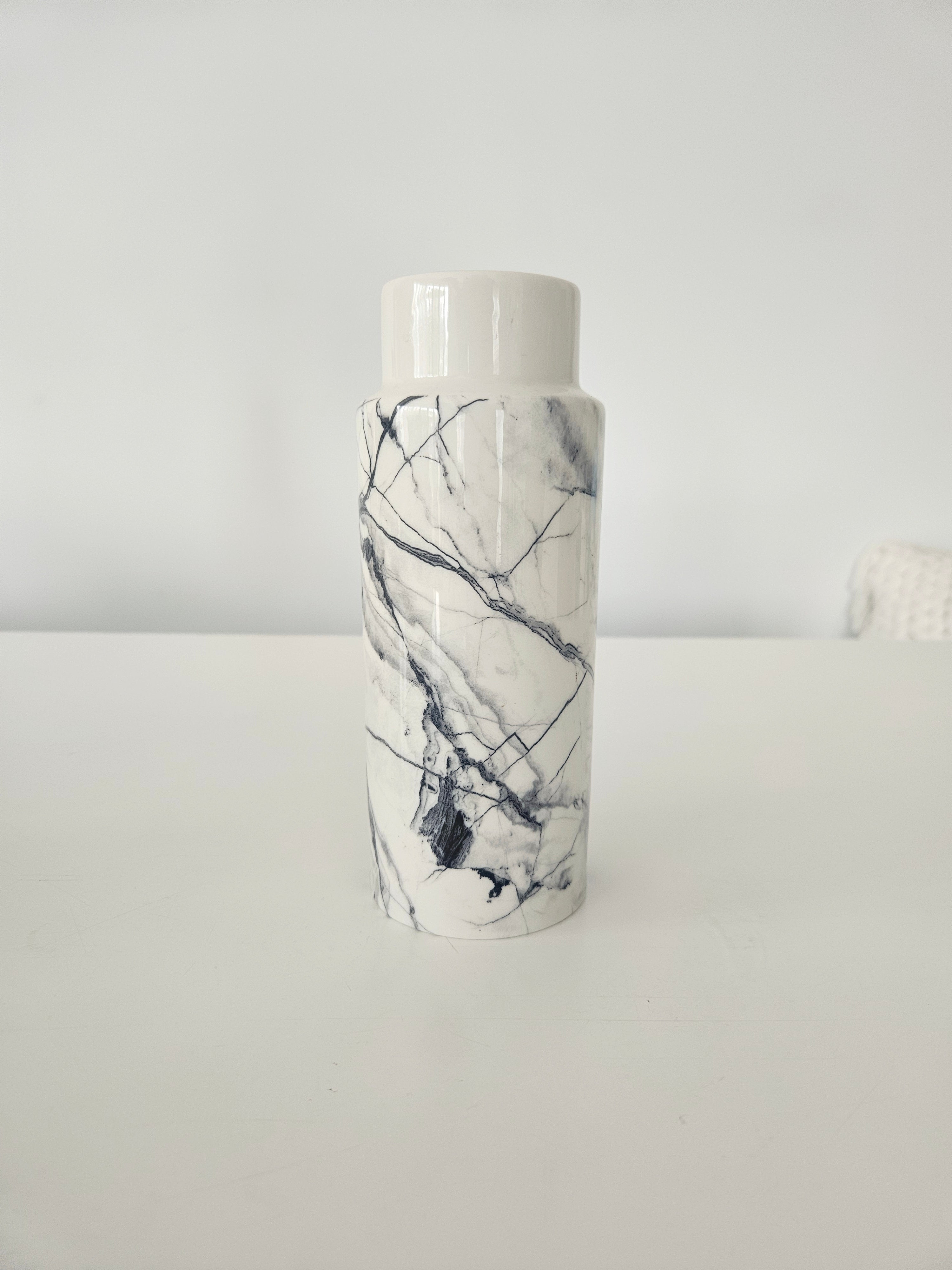 Vase with a marble pattern on a white background