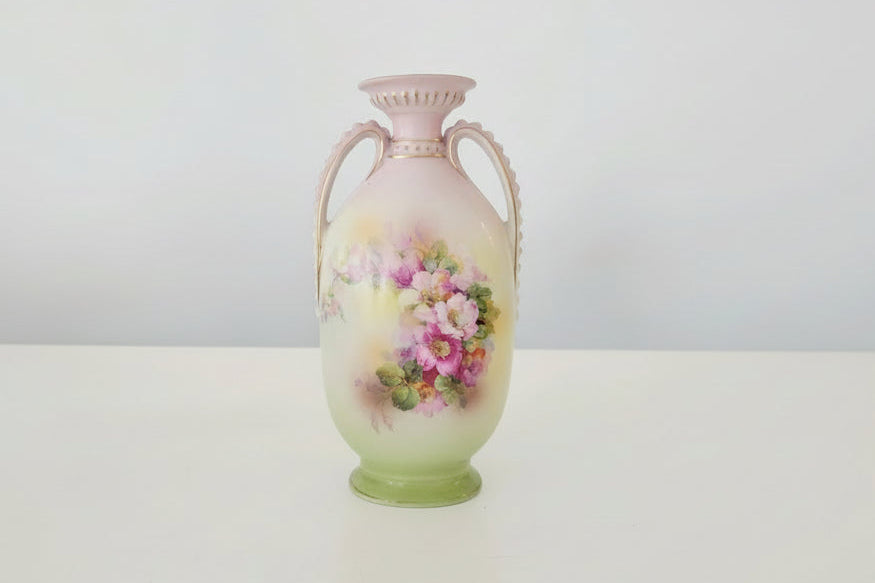 Decorative vase with floral design on a white background