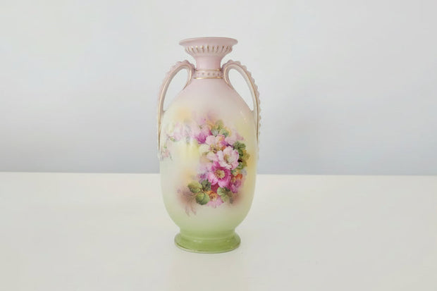 Decorative vase with floral design on a white background