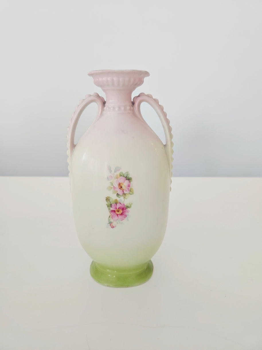 Decorative vase with floral design on a white background