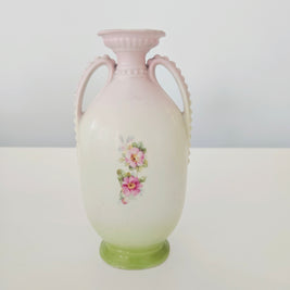 Decorative vase with floral design on a white background