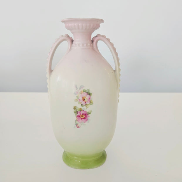 Decorative vase with floral design on a white background