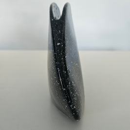 Side view of a black vase