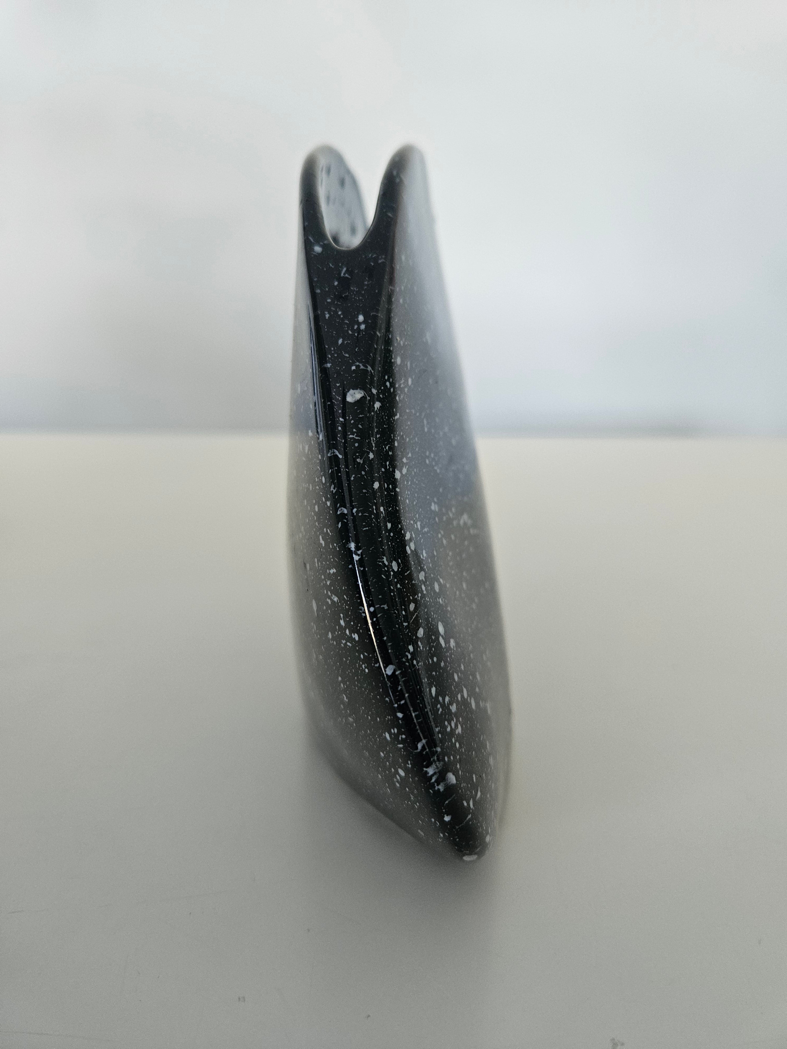 Side view of a black vase