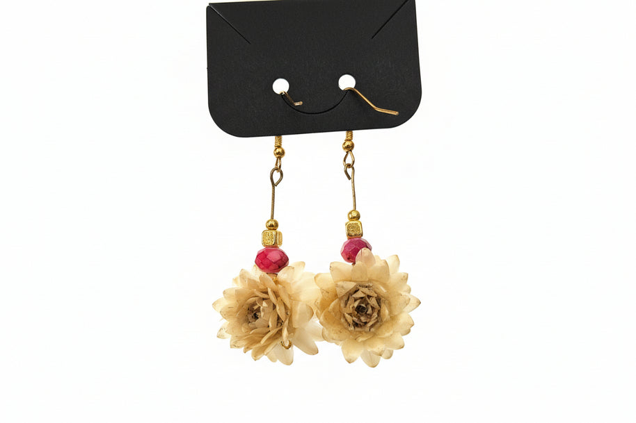 Floral earrings with gold and red accents on a white background