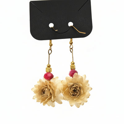 Floral earrings with gold and red accents on a white background