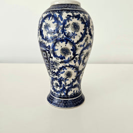 Blue and white ceramic vase on a white background
