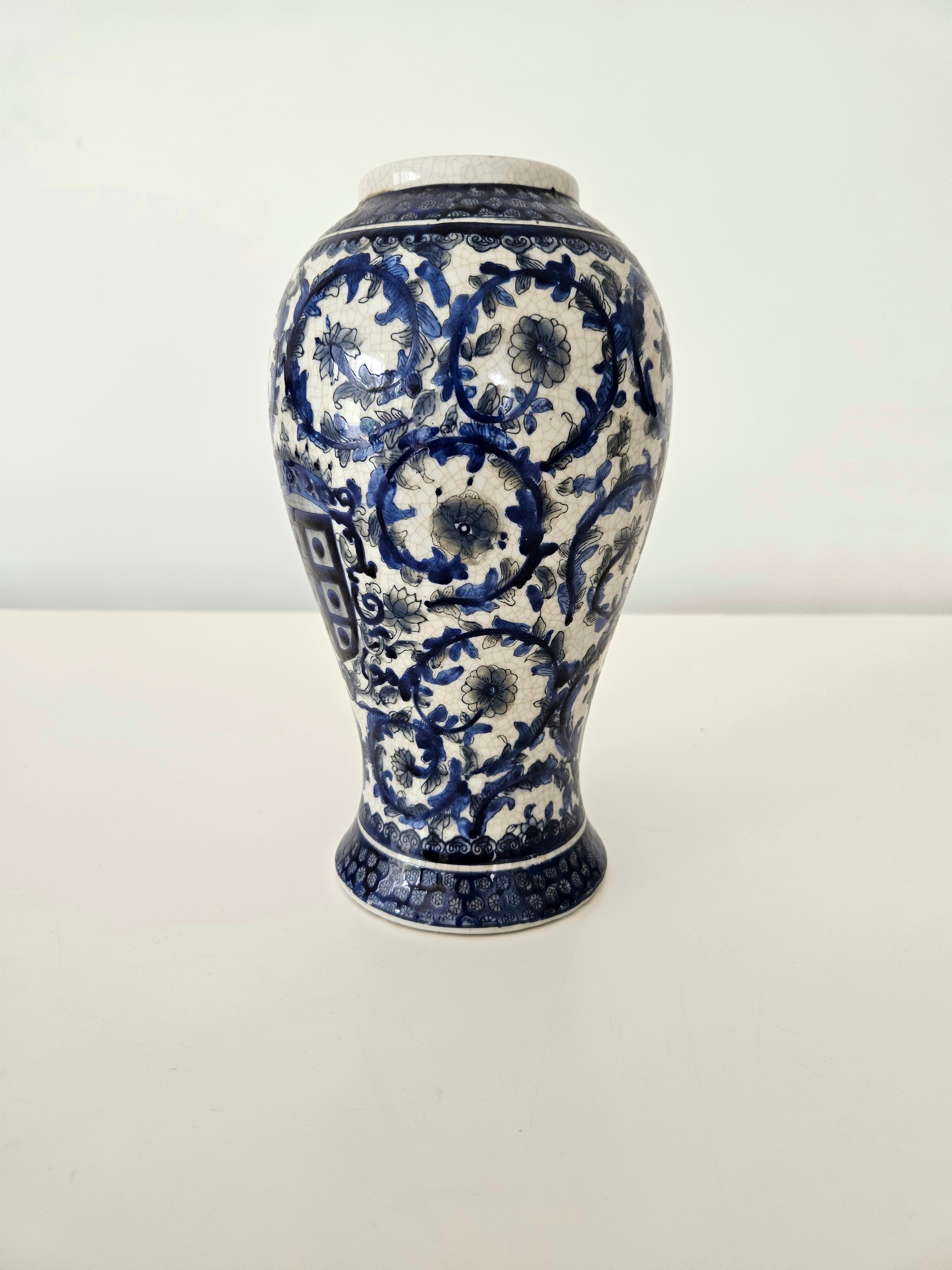 Blue and white ceramic vase on a white background