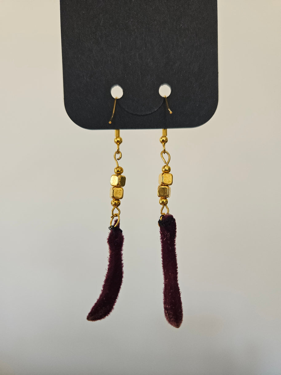 pair of gold earrings made from kangaroo paw