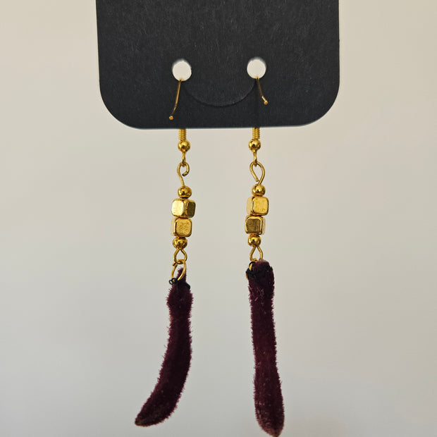 pair of gold earrings made from kangaroo paw