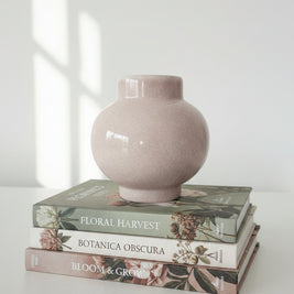 Pink ceramic vase on a white background